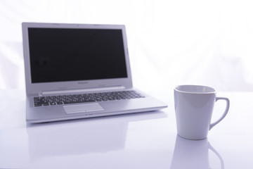 Fototapeta premium Office desk selective focus on white glass