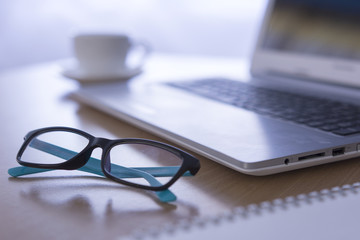 Office desk selective focus on glasses