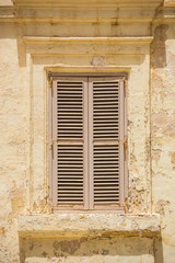 white wooden window shutters