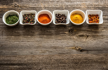 spices in bowls in horizontal row