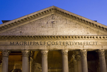 Pantheon pediment close up at night in Rome, Italy
