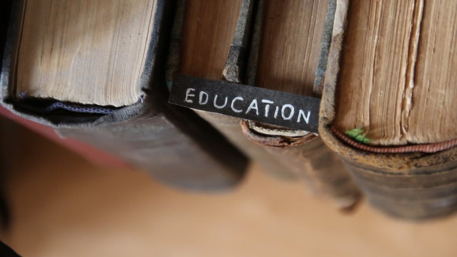 education idea, inscription on the label "education" and books