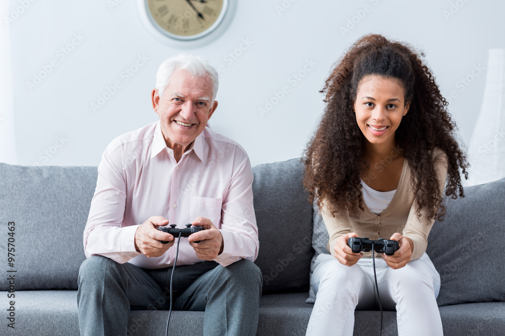 Wall mural Holding joysticks and playing games