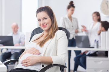 Female boss being in pregnancy
