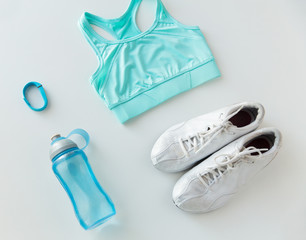 close up of sportswear, bracelet and bottle