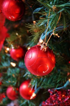 Red Ornaments On A Christmas Tree