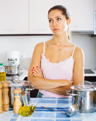 Tired woman at the kitchen