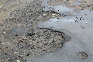 large pits with asphalt
