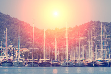  Accumulation of yachts on the water against the sky,  mountains