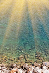 Stone beach. Sea water. Gray and blue. Seascape.
