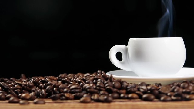 warm cup of coffee is added to the milk roasted coffee beans