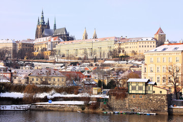 Fototapeta na wymiar Christmas snowy Prague gothic Castle above River Vltava, Czech Republic