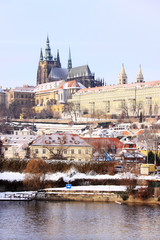 Christmas snowy Prague gothic Castle above River Vltava, Czech Republic