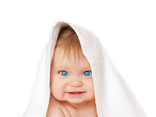 Blue-eyed baby under white towel