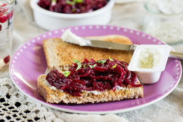 Grated beetroot with basil and goat's cheese on toast