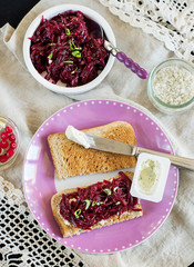 Grated beetroot with basil and goat's cheese on toast