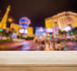 Wood table top with blur Las vegas background