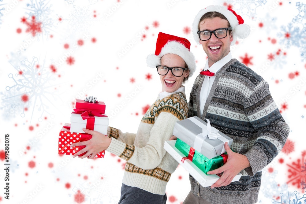 Wall mural portrait of happy man and woman wearing santa clothes