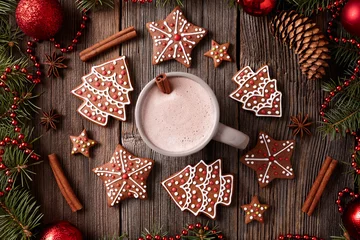  Cup of hot chocolate or cocoa with gingerbread cookies composition in new year decoration frame on vintage wooden table background. Homemade traditional recipe © GreenArt Photography