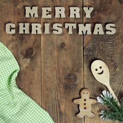 text Merry Christmas on old wooden background