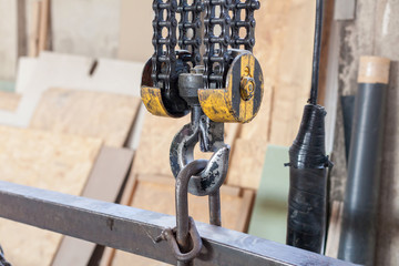 Closeup of Metallic industrial hook for lifting heavy thing in the factory