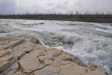 Turbulent rapids on the river.