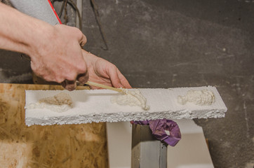 Applying PU foam on styrofoam.Thermal insulation.Selective focus
