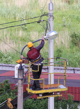 Electricians in the basket aerial platforms.