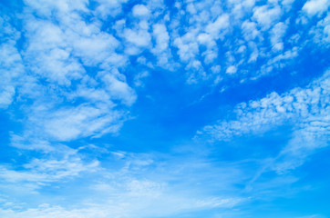 blue sky background with tiny clouds