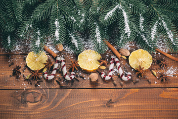 Christmas food decor and fir tree branch on wooden table
