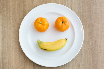 Smiling face on white plate