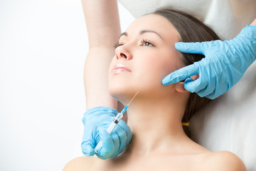 correcting injection in the chin of young woman - 97584860