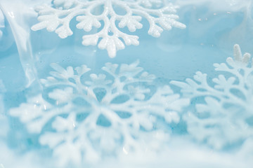 snowflake melts in water macro background