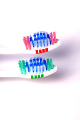 close-up of  blue  abd green tooth brushes