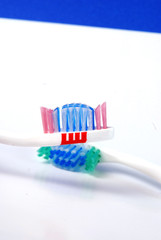 close-up of  blue  abd green tooth brushes