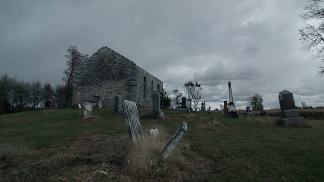 Time Lapse of a Very Dark and Sullen Halloween kind of Footage of Abandoned Church and Cemetery on a Moody Cloudy Day