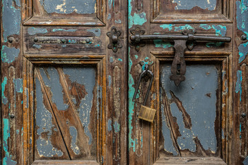 Vintage wood door with padlock , close up