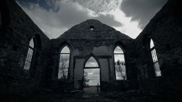 Abandoned Old Irish Church Ruins with no Roof and Clouds Time Lapse with Rays of Sun Light.