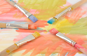 Fototapeta premium Paintbrushes on colorful painting
