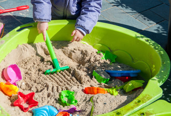 Child playing in sandbox