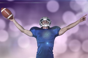 Fototapeta na wymiar Composite image of sportsman gesturing victory