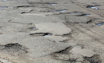 large pits with asphalt