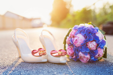 Wedding shoes and bouquet