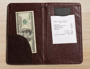 Folder with bill and money