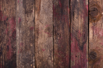 Old weathered wooden planks background with red paint marks