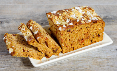 gingerbread cake, cut into slices on wooden table