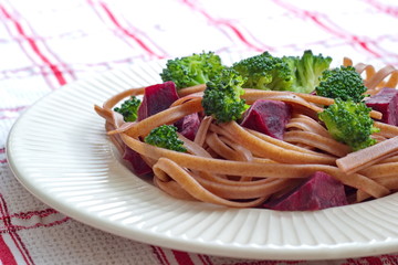 dark pasta with cooked beetroot and broccoli