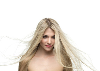 portrait of a beautiful blonde woman with hair fluttering in the