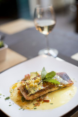 Grilled salmon with sauce and herbs