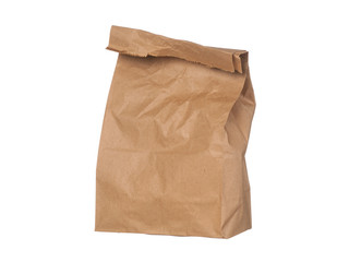 Brown paper bag closed standing isolated on white